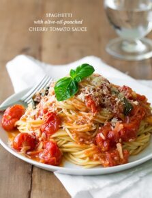 Cherry tomato sauce and spaghetti on a white plate